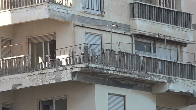 Broken balcony of apartments at the beach in Varosha, a once thriving vacation and resort destination in Famagusta, Cyprus