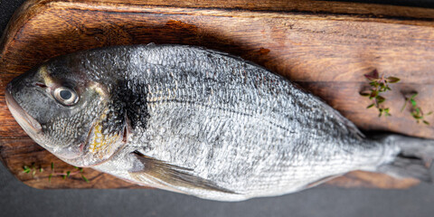 sea bream fresh fish seafood raw ready to cook healthy meal food snack on the table copy space food background rustic top view pescatarian diet