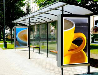 bus shelter at a busstop. blank billboard ad display. empty white lightbox sign. glass and aluminum...