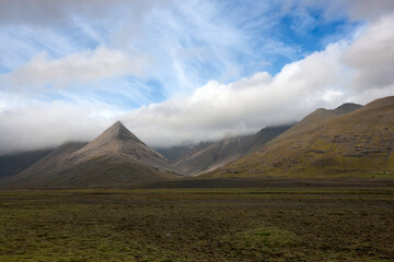 landscape with hills and clouds in iceland