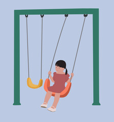 A little girl is swinging on a playground swing. 