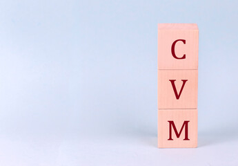 CVM on wooden cubes on a blue background