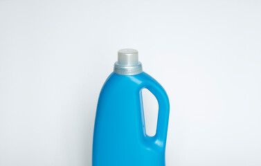 Softener in blue plastic bottle isolated on white background. Bottle with liquid laundry detergent, cleaning agent, bleach or fabric softener. Product design. Mock up.