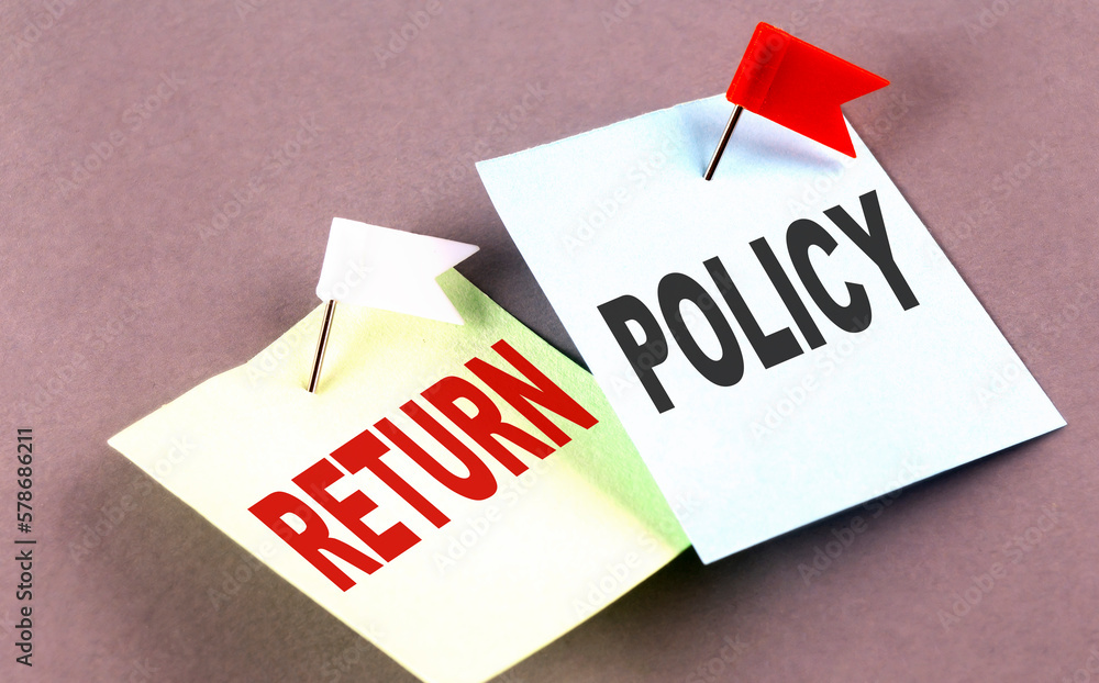 Poster return policy text on a sticky on grey background