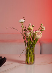 vertical photo of a wedding bouquet of white flowers in a vase with space for a signature