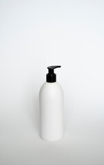 Liquid container for gel, lotion, cream, shampoo, bath foam. Cosmetic plastic bottle with black dispenser pump.