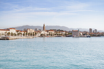Fototapeta na wymiar A view of the waterfront of the Croatian city of Split from the sea side in sunny weather.