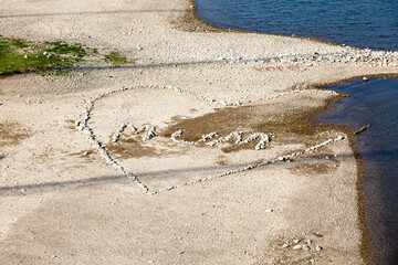 Heart from stones on the river shore