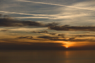 beautiful view of the sea in the evening with clouds and sutset