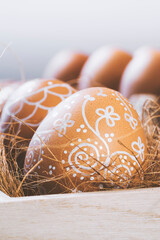 Hand painted floral pattern easter eggs in wooden crate