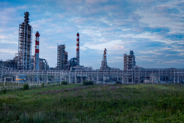 The building of an industrial enterprise at dawn. Building silhouette. 