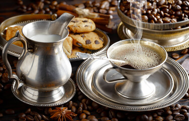 Espresso coffee with coffee beans on old background.