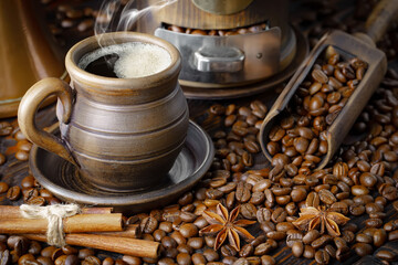 Espresso coffee with coffee beans on old background.
