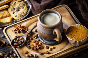 Espresso coffee with coffee beans on old background.