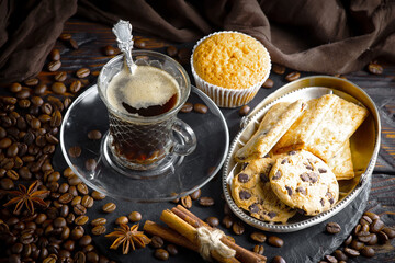 Espresso coffee with coffee beans on old background.
