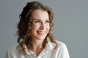 Fototapeta premium Portrait of smiling mature woman looking away