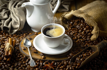 Espresso coffee with coffee beans on old background.