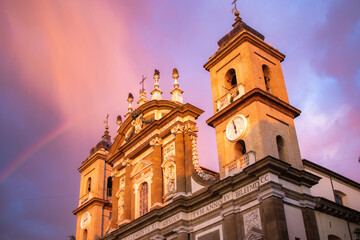 Rainbow over an old roman church in Frascati town, Rome, Italy