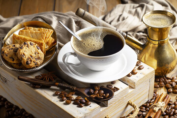 Espresso coffee with coffee beans on old background.