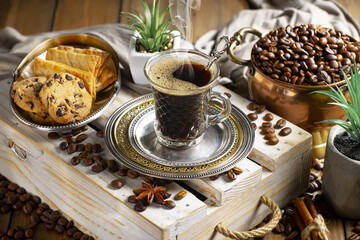 Espresso coffee with coffee beans on old background.