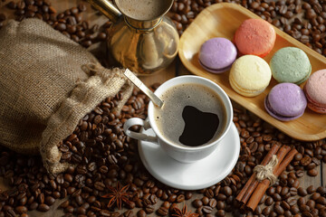 Espresso coffee with coffee beans on old background.