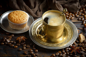 Espresso coffee with coffee beans on old background.