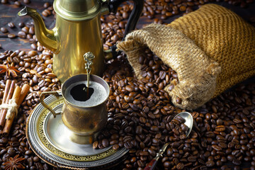 Espresso coffee with coffee beans on old background.