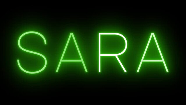 Flickering green retro style neon sign glowing against a black background