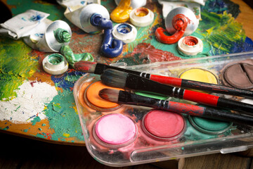 Paints and brushes for drawing. Artistic creativity.