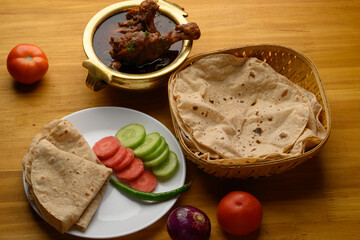 Saoji or savji chicken is a popular Indian food consists of poultry meat, served with chapati ,rice, salad 
