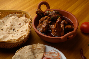 Saoji or savji chicken is a popular Indian food consists of poultry meat, served with chapati ,rice, salad 