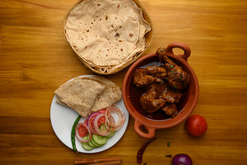 Saoji or savji chicken is a popular Indian food consists of poultry meat, served with chapati ,rice, salad 
