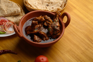 Saoji or savji chicken is a popular Indian food consists of poultry meat, served with chapati ,rice, salad 