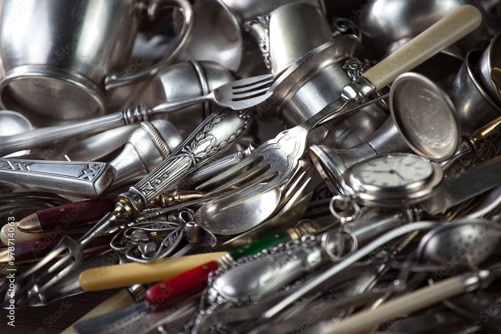 Wall mural silverware on an old background.