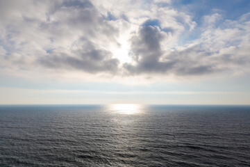 Sun and clouds over the ocean