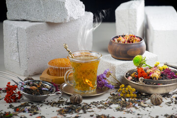 Hot sweet tea in a cup on old background