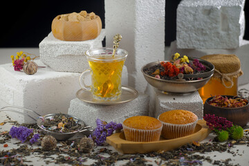 Hot sweet tea in a cup on old background