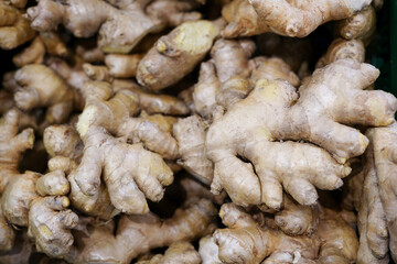a lot of ginger in the store . A lot of Ginger Root. ginger harvest. ginger root food background.