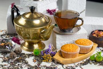 Sweet, hot tea with dessert, on an old background.