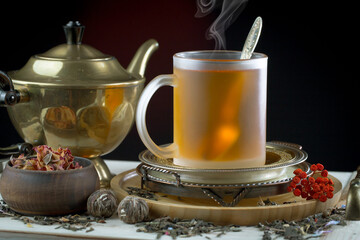 Sweet, hot tea with dessert, on an old background.