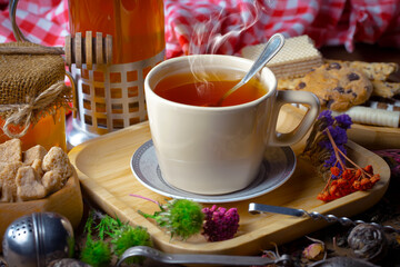 Sweet, hot tea with dessert, on an old background.