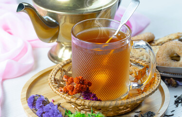 Sweet, hot tea with dessert, on an old background.