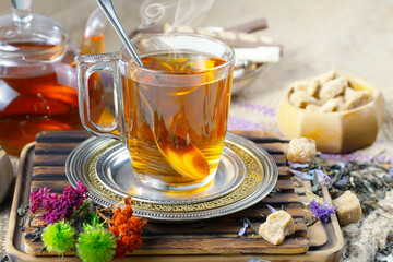 Sweet, hot tea with dessert, on an old background.