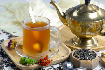 Sweet, hot tea with dessert, on an old background.