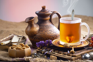 Sweet, hot tea with dessert, on an old background.
