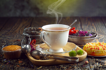 Hot sweet tea in a cup on old background