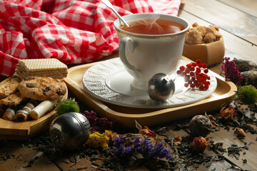 Sweet, hot tea with dessert, on an old background.