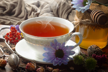 Sweet, hot tea with dessert, on an old background.