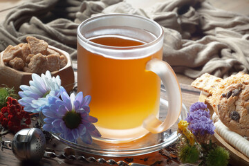 Sweet, hot tea with dessert, on an old background.