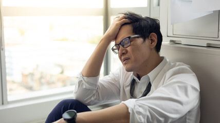 Overload office worker. Alone stressed and sad  asian office worker is sitting beside error copy...
